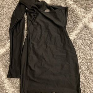 A black mini dress with one sleeve. Never worn and a Large